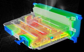 Computer-generated graphic depicting an internal view of a device with thermal simulations in various colors, indicating temperature distribution and showcasing CFD applications.